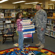 Picture of Soldier and student shaking hands